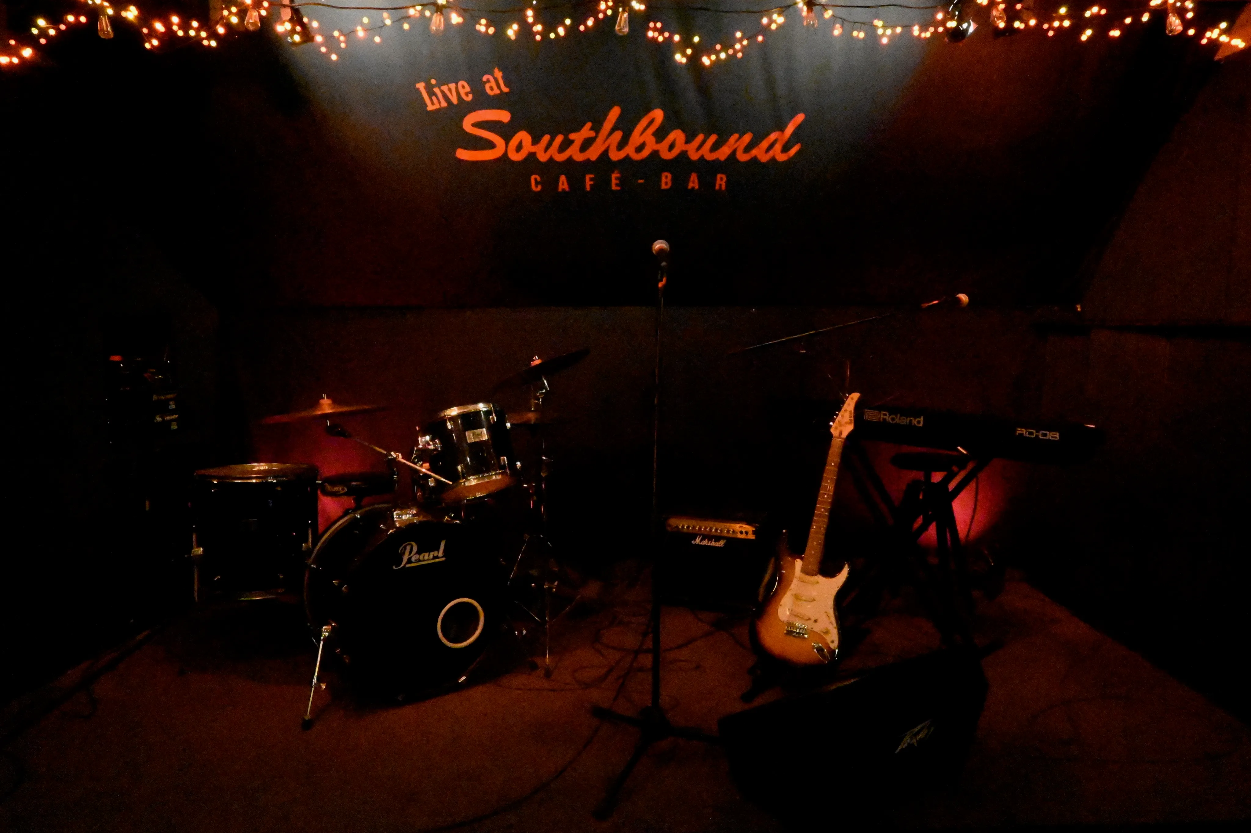 Southbound stage with drum kit, piano and guitar.